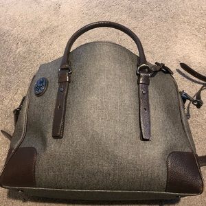 Tumi carry on bag with multiple pockets.